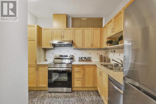 801 - 44 Bond Street W, Oshawa, ON - Indoor Photo Showing Kitchen With Double Sink