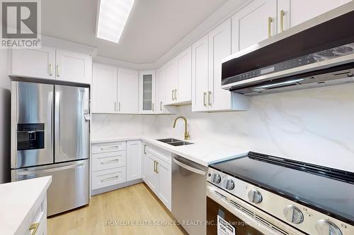 610 - 120 Dundalk Drive, Toronto, ON - Indoor Photo Showing Kitchen With Double Sink