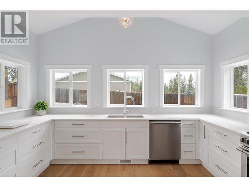 New custom kitchen with quartz & Westwood cabintery - 3960 June Springs Road, Kelowna, BC - Indoor Photo Showing Kitchen