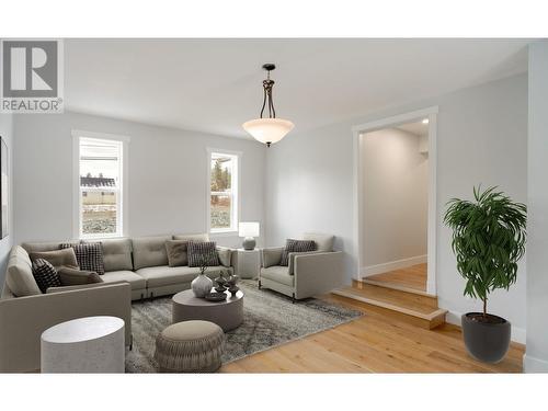 This photo has been photoshopped to add furniture - 3960 June Springs Road, Kelowna, BC - Indoor Photo Showing Living Room