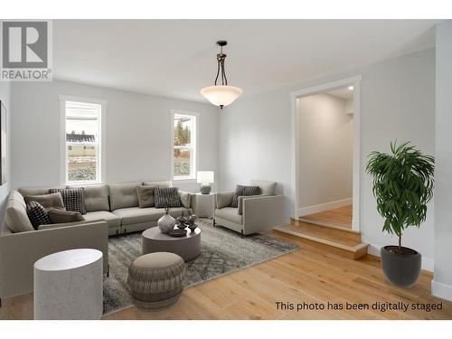 Secondary living space on the main- ideal for a family - 3960 June Springs Road, Kelowna, BC - Indoor Photo Showing Living Room