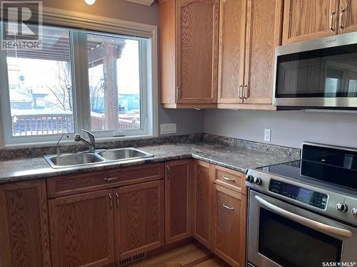 201 Milburn Street, Melfort, SK - Indoor Photo Showing Kitchen With Double Sink