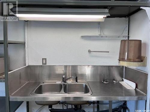 201 Milburn Street, Melfort, SK - Indoor Photo Showing Kitchen With Double Sink