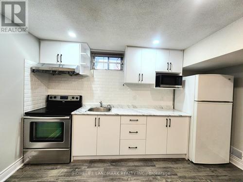 Bsmt - 62 Rainier Square, Toronto, ON - Indoor Photo Showing Kitchen