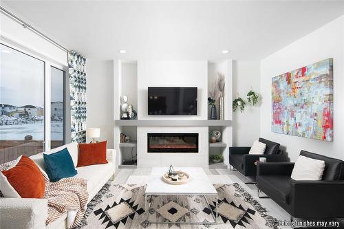 34 Barnes Place, West St Paul, MB - Indoor Photo Showing Living Room With Fireplace