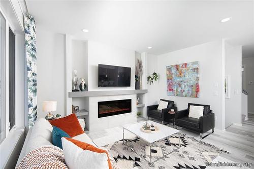 34 Barnes Place, West St Paul, MB - Indoor Photo Showing Living Room With Fireplace