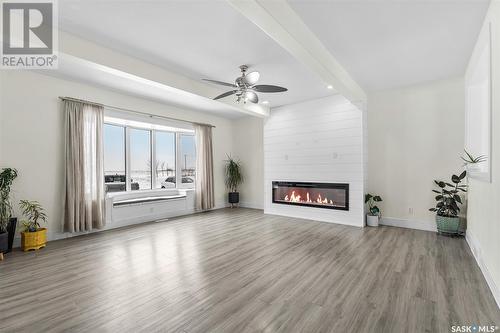 305075 Mierau Road, Corman Park Rm No. 344, SK - Indoor Photo Showing Living Room With Fireplace