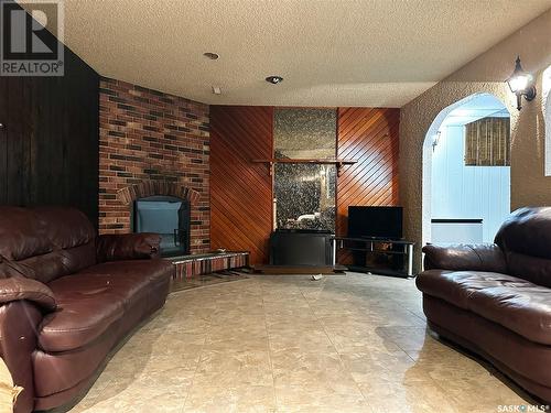 342 28Th Street, Battleford, SK - Indoor Photo Showing Living Room With Fireplace