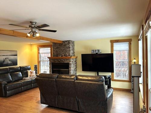 Living room - 33 Ch. Larochelle, Saint-Claude, QC - Indoor Photo Showing Living Room With Fireplace