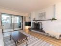 106-3160 Irma St, Victoria, BC  - Indoor Photo Showing Living Room With Fireplace 