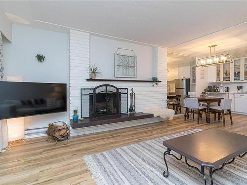 106-3160 Irma St, Victoria, BC - Indoor Photo Showing Living Room With Fireplace