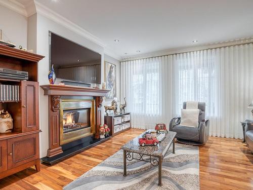 Living room - 715 Rue Des Séminaristes, Saint-Hyacinthe, QC - Indoor Photo Showing Living Room With Fireplace