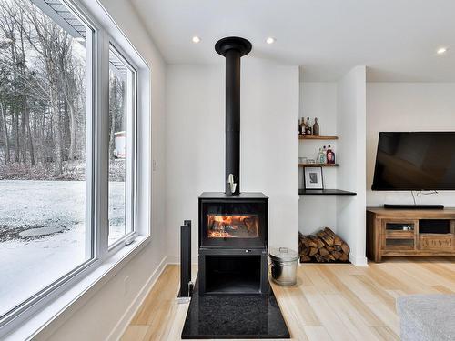 Living room - 1840 Rue Papillon, Sainte-Julienne, QC - Indoor With Fireplace