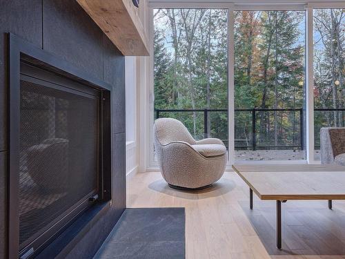 Salon - Rue Gilles, Saint-Côme, QC - Indoor Photo Showing Other Room With Fireplace