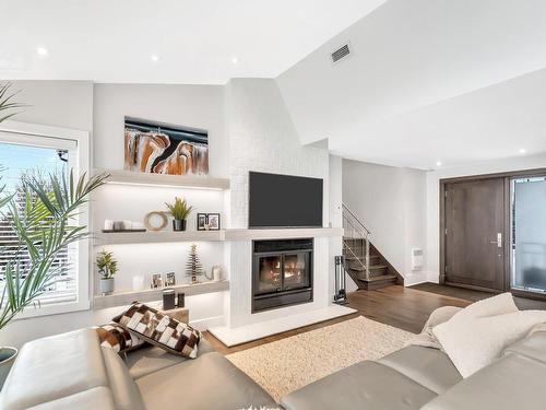 Living room - 161  - C Rue Montcalm, Bromont, QC - Indoor Photo Showing Living Room With Fireplace