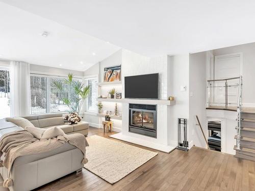 Living room - 161  - C Rue Montcalm, Bromont, QC - Indoor Photo Showing Living Room With Fireplace