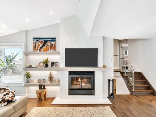 Living room - 161  - C Rue Montcalm, Bromont, QC - Indoor Photo Showing Living Room With Fireplace