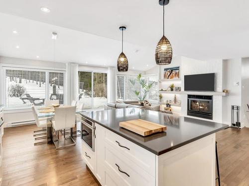 Kitchen - 161  - C Rue Montcalm, Bromont, QC - Indoor Photo Showing Kitchen With Fireplace With Upgraded Kitchen