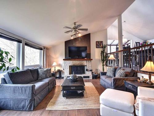 Living room - 133 Rue St-Jean, Mont-Tremblant, QC - Indoor Photo Showing Living Room With Fireplace