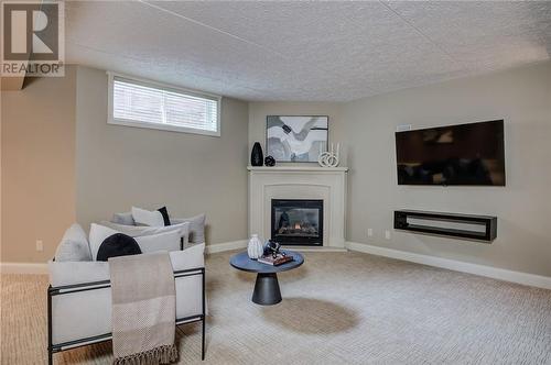 15 Platinum, Sudbury, ON - Indoor Photo Showing Other Room With Fireplace