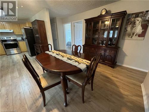 Dining area featuring hardwood / wood-style flooring and a textured ceiling - 3877 Highway 17 E, Mattawa, ON - Indoor Photo Showing Dining Room