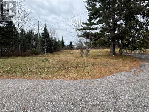 View of front facade with a front lawn - 3877 Highway 17 E, Mattawa, ON - Outdoor