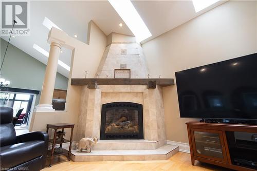 Living room with light wood-type flooring, a fireplace, and high vaulted ceiling - 748 Coursol Road, Sturgeon Falls, ON - Indoor Photo Showing Living Room With Fireplace