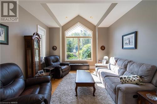 Living room with light hardwood / wood-style flooring and vaulted ceiling - 748 Coursol Road, Sturgeon Falls, ON - Indoor Photo Showing Living Room