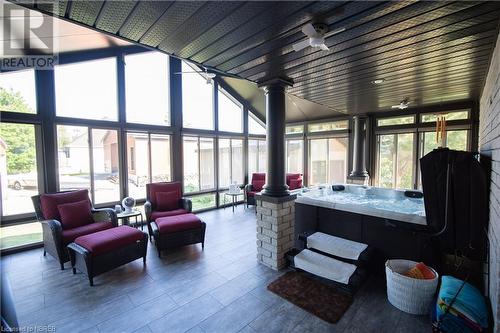 Sunroom / solarium featuring a jacuzzi and a wealth of natural light - 748 Coursol Road, Sturgeon Falls, ON - Indoor