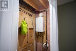 Utility room featuring water heater - 