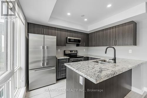 07 - 100 Dufay Road, Brampton, ON - Indoor Photo Showing Kitchen With Stainless Steel Kitchen With Upgraded Kitchen