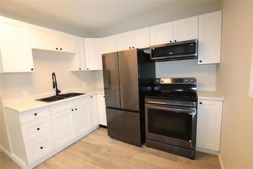 230 Paul Avenue, The Pas, MB - Indoor Photo Showing Kitchen With Double Sink