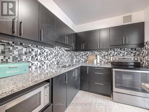 407 - 5 Vicora Linkway, Toronto, ON - Indoor Photo Showing Kitchen With Double Sink With Upgraded Kitchen