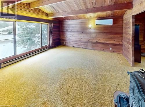 Living room with heat pump - 50 Besserer Road, North Bay, ON - Indoor Photo Showing Other Room