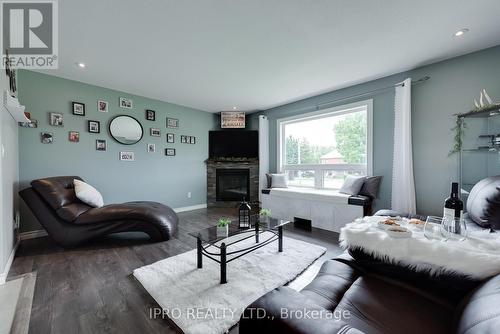 8961 Wellington Road 16, Wellington North, ON - Indoor Photo Showing Living Room With Fireplace