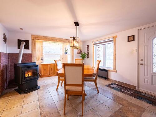 Dining room - 3 Rue Des Peupliers, L'Islet, QC - Indoor Photo Showing Dining Room With Fireplace