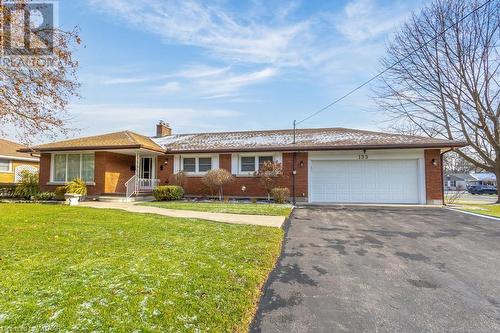 Ranch-style house with a front yard and a garage - 133 Fairview Crescent, Woodstock, ON - Outdoor With Facade