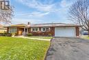 Ranch-style house with a front yard and a garage - 133 Fairview Crescent, Woodstock, ON  - Outdoor With Facade 