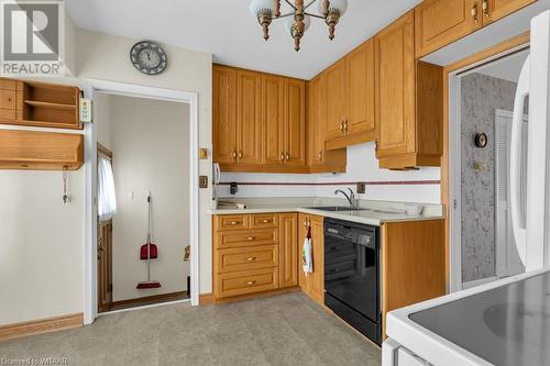 Kitchen featuring sink, a chandelier, and black dishwasher - 133 Fairview Crescent, Woodstock, ON - Indoor Photo Showing Kitchen