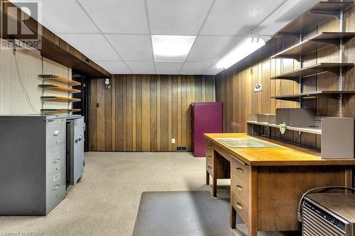 Carpeted office with a drop ceiling and wooden walls - 133 Fairview Crescent, Woodstock, ON - Indoor Photo Showing Basement