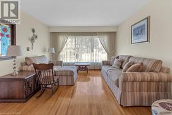 Living room featuring light hardwood / wood-style flooring - 