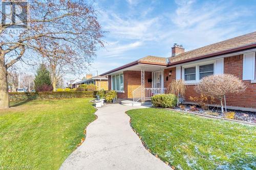 View of front of property with a front lawn - 133 Fairview Crescent, Woodstock, ON - Outdoor With Deck Patio Veranda