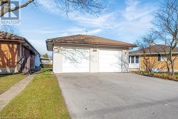 Garage featuring a lawn - 