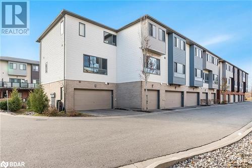 Back of the property showing garage - 369 Essa Road Unit# 22, Barrie, ON - Outdoor