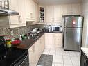 209 - 120 Dundalk Drive, Toronto, ON  - Indoor Photo Showing Kitchen With Double Sink 