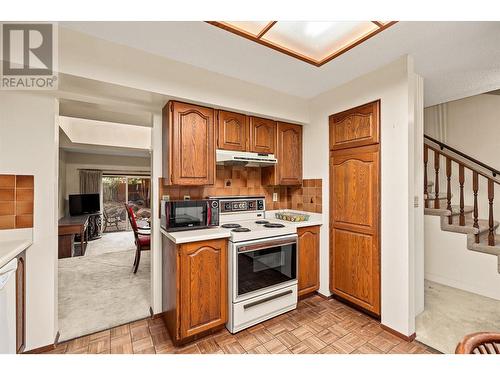 Pantry cupboard on the right - 1995 Burtch Road Unit# 108, Kelowna, BC - Indoor Photo Showing Kitchen