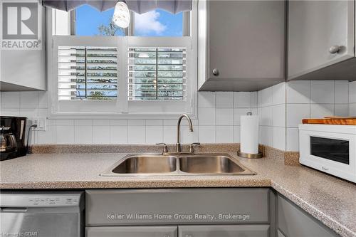 108 - 89 Westwood Road, Guelph (West Willow Woods), ON - Indoor Photo Showing Kitchen With Fireplace With Double Sink