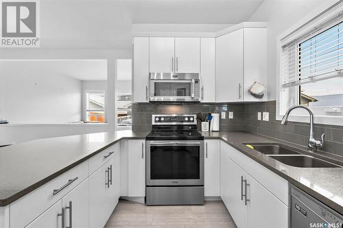 443 Secord Way, Saskatoon, SK - Indoor Photo Showing Kitchen With Double Sink