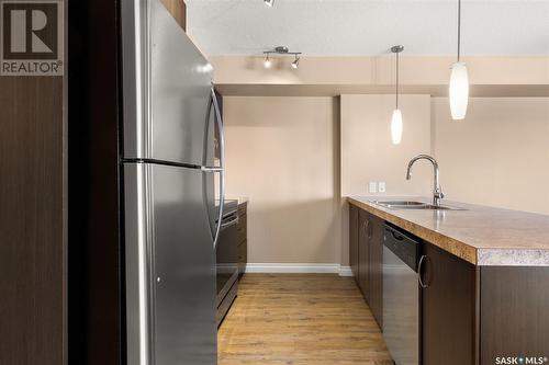 213 5303 Universal Crescent, Regina, SK - Indoor Photo Showing Kitchen With Stainless Steel Kitchen With Double Sink With Upgraded Kitchen