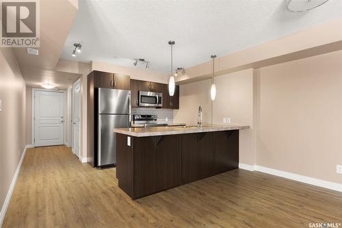 213 5303 Universal Crescent, Regina, SK - Indoor Photo Showing Kitchen With Stainless Steel Kitchen With Upgraded Kitchen